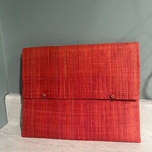 Reddish pink wicker envelope bag